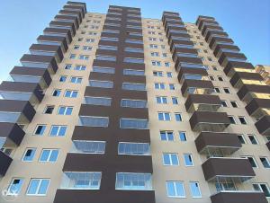 a tall building with many windows on it at Sarajevo Otoka - Stan na dan in Sarajevo