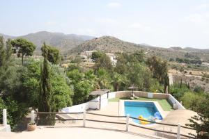 a villa with a swimming pool and a mountain at Apartment Isabel in Sorbas