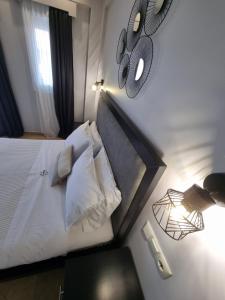 Postel nebo postele na pokoji v ubytování GreenHill Holiday Suites