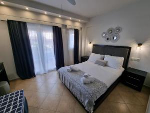 Postel nebo postele na pokoji v ubytování GreenHill Holiday Suites