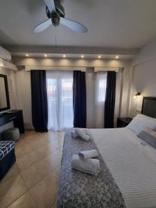 Postel nebo postele na pokoji v ubytování GreenHill Holiday Suites
