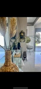 a room with a glass table with a vase at Apartment sea view in Chalkida