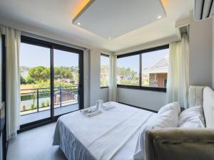 Ένα ή περισσότερα κρεβάτια σε δωμάτιο στο Memories Downtown Villas