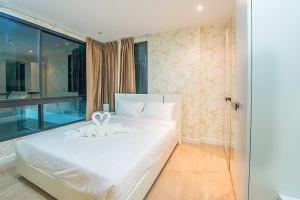 Voodi või voodid majutusasutuse O2 Hotel Maesot toas