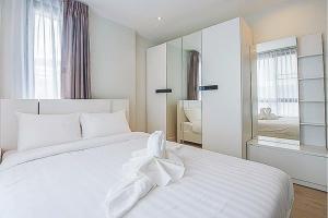 Postel nebo postele na pokoji v ubytování O2 Hotel Maesot