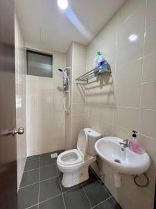 a bathroom with a toilet and a sink at MuciHome 3R2B Residensi Zamrud, Kajang 2, Bandar Baru Bangi - non smoking sweethome for Malaysian and Borneo Guests only in Kajang