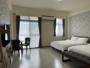 Postel nebo postele na pokoji v ubytování Suixiang B&B