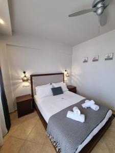 Postel nebo postele na pokoji v ubytování GreenHill Holiday Suites