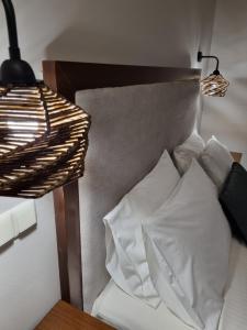 Postel nebo postele na pokoji v ubytování GreenHill Holiday Suites