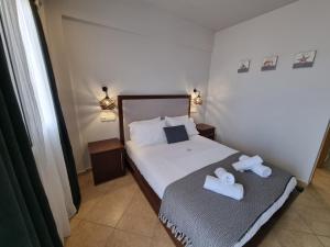 Postel nebo postele na pokoji v ubytování GreenHill Holiday Suites