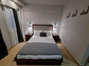 Postel nebo postele na pokoji v ubytování GreenHill Holiday Suites