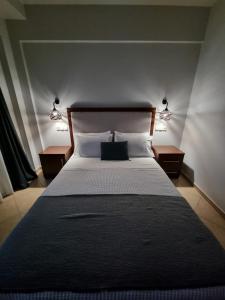 Postel nebo postele na pokoji v ubytování GreenHill Holiday Suites