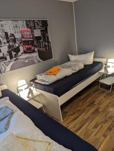 a bedroom with a bed and a picture of a bus at Flensburg Zentrum 50 in Flensburg