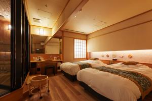 Postel nebo postele na pokoji v ubytování Takinoyu Hotel + 37 fotografií