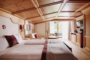 Posteľ alebo postele v izbe v ubytovaní Burg Hotel Oberlech