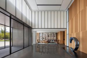 a view of a living room with a glass wall at Fairfield by Marriott Changsha Yuelu in Changsha