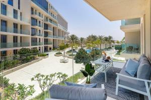 an open balcony with a view of a building at Frank Porter - Al Saadiyat Island in Abu Dhabi