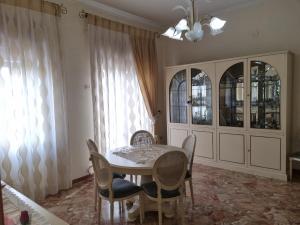 a dining room with a table and chairs at ANNUCCIA APARTMENT in Angri