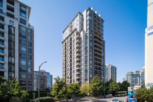 a tall building in a city with tall buildings at Astoria Elegance by Iris Properties in Victoria
