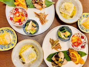 a group of plates of food on a table at 幡谷温泉 ささの湯 in Hataya