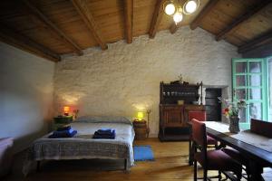 a bedroom with a bed and a table in a room at Suite Chevalier Claudio in Agnone