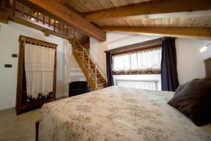 Postel nebo postele na pokoji v ubytování B&B Lo Tatà
