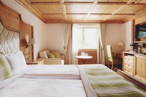 Posteľ alebo postele v izbe v ubytovaní Burg Hotel Oberlech