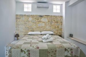Ένα ή περισσότερα κρεβάτια σε δωμάτιο στο Ermis house +41 φωτογραφίες