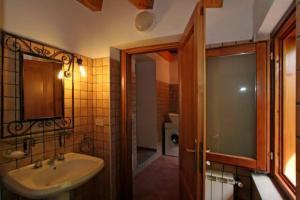 a bathroom with a sink and a mirror and a shower at Casa Rosa 1 in Patti +31 photos