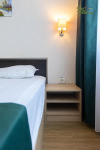 Postel nebo postele na pokoji v ubytování Hotel Flora