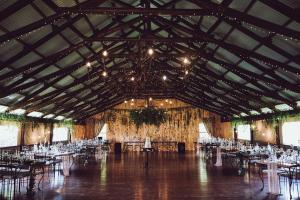 a large banquet hall with white tables and chairs at The Vale Karoo Farm in Beaufort West