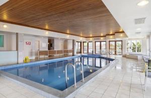 a swimming pool in a large building with a pool at Lorne beach views at the cumberland in Lorne
