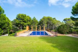 an image of a swimming pool in a yard at Villa Lux Ana in L'Ametlla de Mar