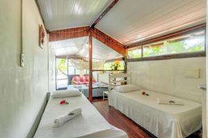 Ein Bett oder Betten in einem Zimmer der Unterkunft Pousada Boas Ondas