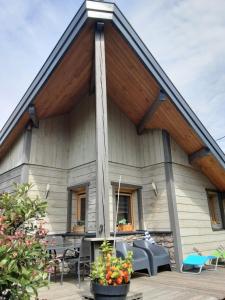 a house with a large gambrel roof at Chalet la Petite Perle in Gérardmer +42 photos