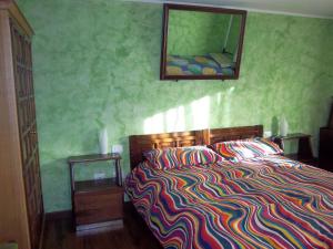 Postel nebo postele na pokoji v ubytování Les Lillas