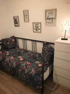 a bedroom with a bed and a dresser at Nice and calm apartment Atocha, Madrid LAC4 in Madrid