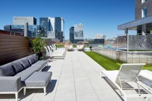 a row of chairs on the roof of a building at Hampton Inn Montreal Downtown, Qc in Montréal