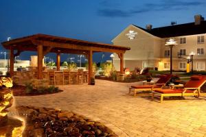 a patio with a fireplace and a gazebo at Homewood Suites by Hilton Decatur-Forsyth in Forsyth
