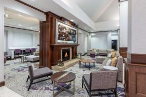 a lobby with a fireplace in a hotel room at Hilton Garden Inn Aiken in Aiken