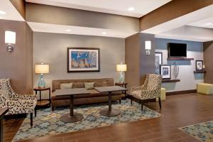 a living room with a couch and chairs at Hampton Inn Dekalb - Near the University in DeKalb