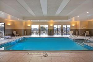 a large pool in a hotel room with at Hampton Inn Dekalb - Near the University in DeKalb