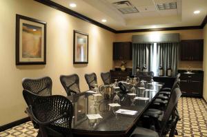 a conference room with a long table and chairs at Hilton Garden Inn Cartersville in Cartersville