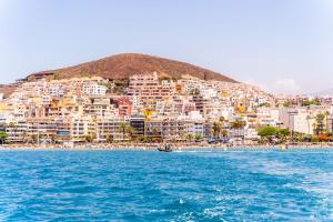 a view of a city from the water at Ocean Nomads Coworking in Arona