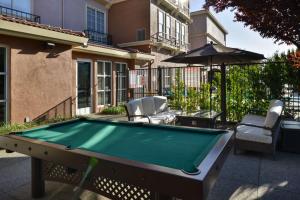 a pool table in front of a house at Hilton Garden Inn Napa in Napa