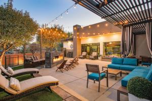 an outdoor patio with furniture and a fireplace at Hampton Inn Prescott in Prescott