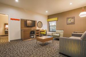 a living room with a couch and a tv at Hampton Inn Prescott in Prescott