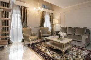 a living room with a couch and chairs and a table at Domus Zamittello in Valletta