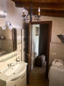 a bathroom with a sink and a mirror at Oasi Rubino in Nettuno