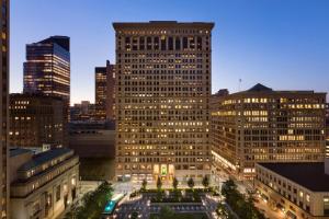 a view of a large building in a city at night at Embassy Suites Pittsburgh-Downtown in Pittsburgh